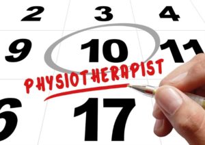 a hand scheduling physiotherapist on a calendar