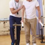 physiotherapist with older patient