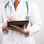 doctor with tablet