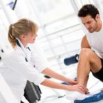female physiotherapist working with a male patient