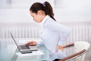 woman at the computer having back pain