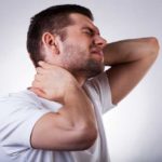 a man hurting with neck pain