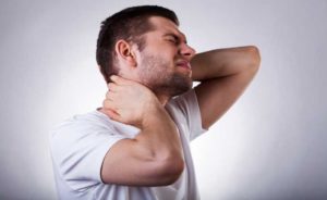 a man hurting with neck pain