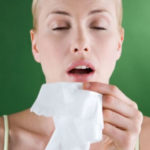 a woman sneezing