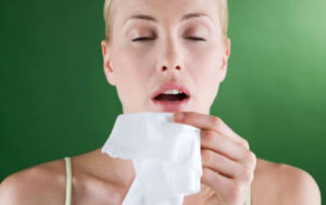 a woman sneezing