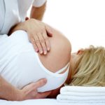 a woman receiving chiropractic treatment