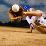 a baseball player catching a ball