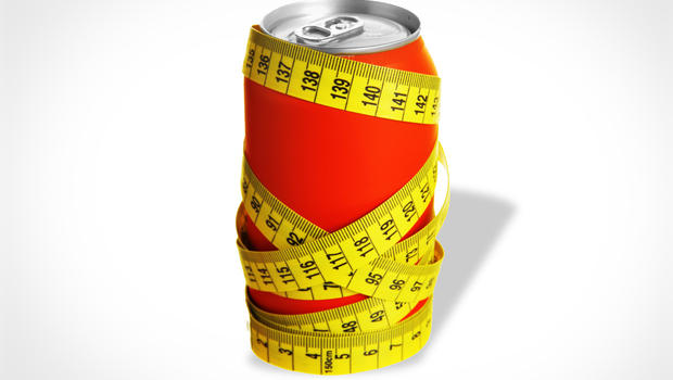 tape measure meter wrapped around soda can
