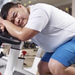 unhappy fat guy in the gym