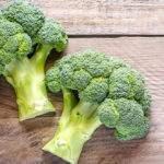 broccoli on wooden surface