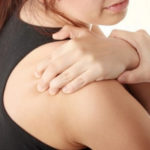 woman with aching shoulder