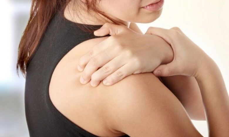 woman with aching shoulder