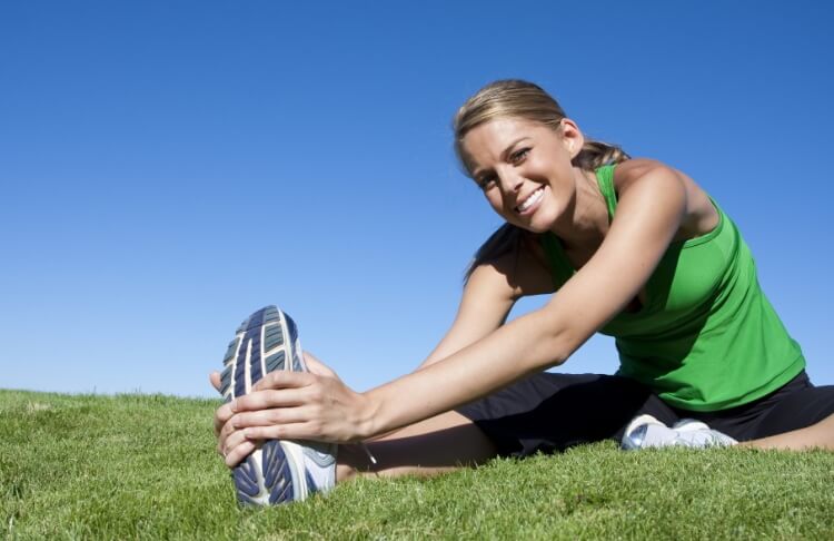 woman stretching before sport activity