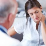 woman with pain at the doctor's ordination