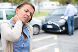 woman in car accident having whiplash