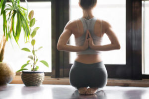 woman in yoga position for good posture